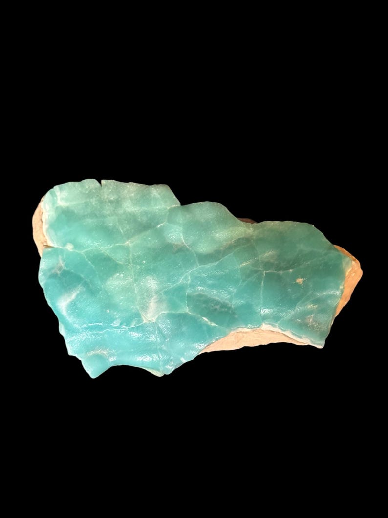 High quality Blue Aragonite on matrix specimen from Crazy Ohio Crystals, weighing 150 grams and measuring 3.5 inches wide, showcasing vibrant aqua-blue crystals on natural earthy base.