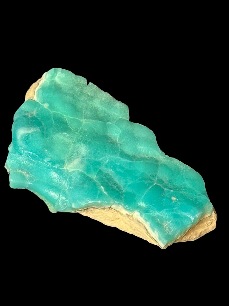 High quality Blue Aragonite on matrix specimen from Crazy Ohio Crystals, weighing 150 grams and measuring 3.5 inches wide, showcasing vibrant aqua-blue crystals on natural earthy base.