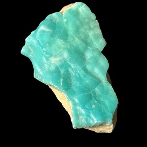 High quality Blue Aragonite on matrix specimen from Crazy Ohio Crystals, weighing 150 grams and measuring 3.5 inches wide, showcasing vibrant aqua-blue crystals on natural earthy base.