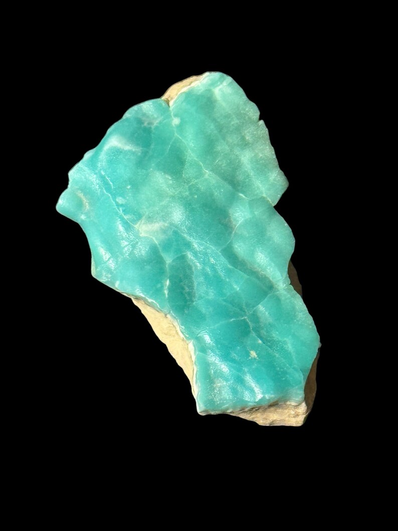 High quality Blue Aragonite on matrix specimen from Crazy Ohio Crystals, weighing 150 grams and measuring 3.5 inches wide, showcasing vibrant aqua-blue crystals on natural earthy base.