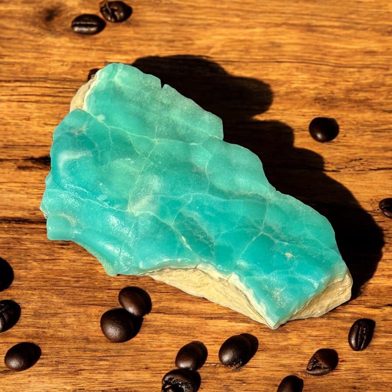 High quality Blue Aragonite on matrix specimen from Crazy Ohio Crystals, weighing 150 grams and measuring 3.5 inches wide, showcasing vibrant aqua-blue crystals on natural earthy base.