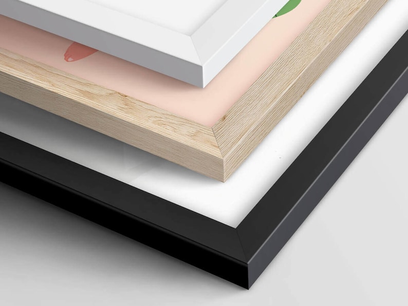 May include: Three picture frames stacked on top of each other. The top frame is white, the middle frame is light wood, and the bottom frame is black.