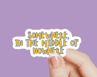 May include: A white sticker with yellow text that reads "Somewhere, in the middle of nowhere".