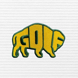 May include: Embroidered patch in the shape of a bison, with the word "GO" in yellow letters outlined in green. The bison shape is also yellow with a green outline. The patch is on a white, textured background.
