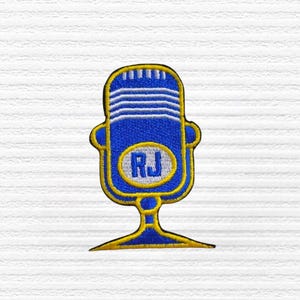 May include: Embroidered patch featuring a blue vintage microphone design with a yellow outline. The microphone has horizontal white lines and an oval with the letters "RJ". The patch is on a white textured background.