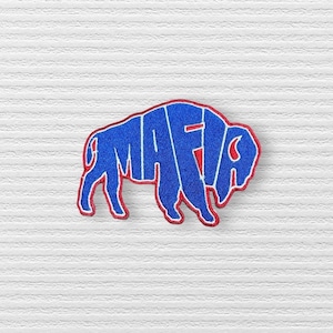 May include: Blue and red embroidered patch of a buffalo with the word "MAFIA" spelled out in the outline of the buffalo.