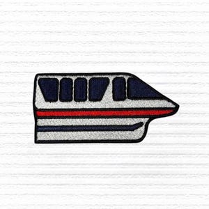 May include: Embroidered patch of a monorail train. The train is primarily white with a red stripe and dark blue accents. The windows are dark blue. The patch has a black border and is on a white background.