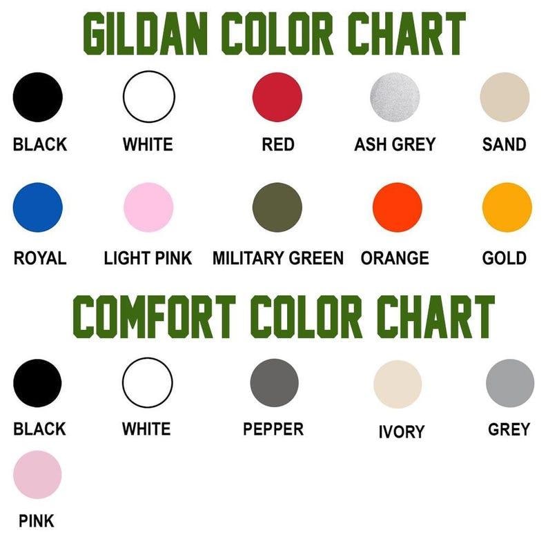 May include: A color chart displaying two sections: Gildan Color Chart with circles in black, white, red, ash grey, sand, royal, light pink, military green, orange, and gold; and Comfort Color Chart with circles in black, white, pepper, ivory, grey, and pink.