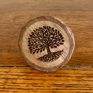 May include: A set of three ceramic mugs with a speckled, matte finish. The mugs are in shades of cream, light gray, and dark gray. Each mug has a simple, minimalist design, perfect for coffee or tea.