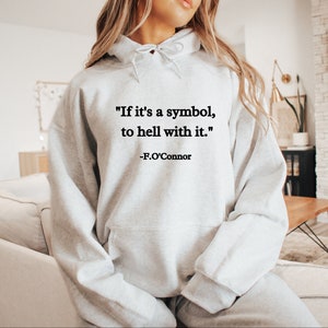 May include: A gray hooded sweatshirt with the quote "If it's a symbol, to hell with it." - F.O'Connor printed on the front.