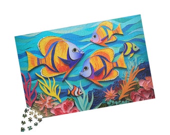 May include: A colorful paper craft puzzle featuring three orange, yellow, and blue fish swimming in a blue ocean with coral reefs and seaweed.