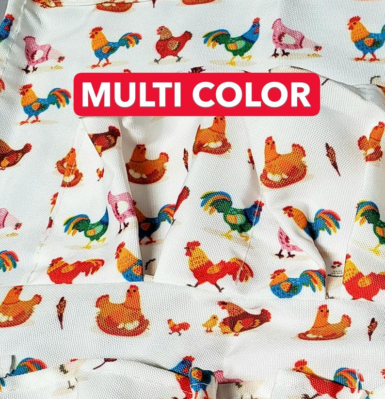 May include: White fabric with a repeating pattern of colorful roosters, hens, and chicks. The roosters are in various colors, including red, blue, green, and orange. The text "MULTI COLOR" is displayed on a red banner.