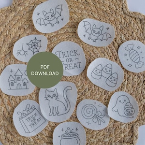 May include: A collection of Halloween-themed embroidery designs, including a bat, spiderweb, haunted house, candy corn, and a cat. The designs are in black and white, with the words "Trick or Treat" on one. The image also includes the text "PDF DOWNLOAD".