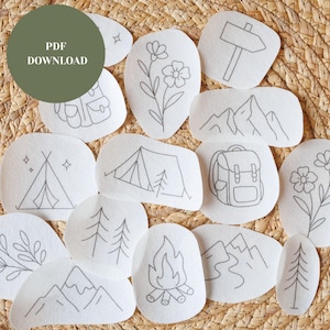 May include: A collection of white, oval-shaped patches with gray line drawings of camping and outdoor themes. Designs include a tent, mountains, flowers, a backpack, a campfire, and trees. The text "PDF DOWNLOAD" is in a green circle.