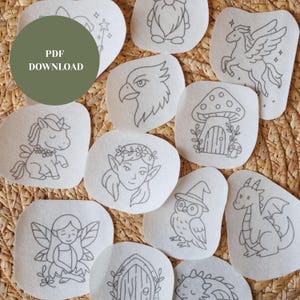 May include: A collection of off-white felt shapes with embroidered fantasy creatures and objects. Designs include a unicorn, fairy, dragon, owl, and mushroom house. The text "PDF DOWNLOAD" is in a green circle.