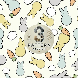 May include: A repeating pattern featuring cartoon bunnies in pastel yellow, blue, and gray, along with orange carrots and white clouds, set against a cream background. The design includes the text "3 PATTERN ATELIER".