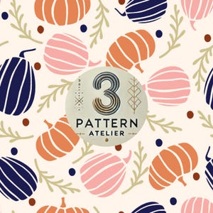 May include: A repeating pattern with stylised pumpkins in orange, pink, and navy blue, with green sprigs and brown dots on a cream background. A circular emblem features the number "3" and the text "PATTERN ATELIER".