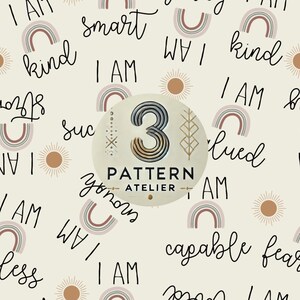 May include: Cream-colored repeating pattern with the words "I AM" and positive affirmations like "kind" and "smart" in black script. Features rainbows and suns in muted tones. A circular logo in the center reads "3 PATTERN ATELIER".