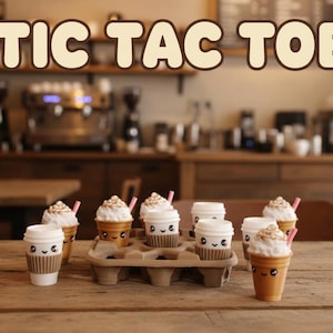 May include: A wooden table displays miniature coffee cup desserts with whipped cream and pink straws. The cups have smiling faces. The text "TIC TAC TOE" is above the cups, set against a blurred cafe background.