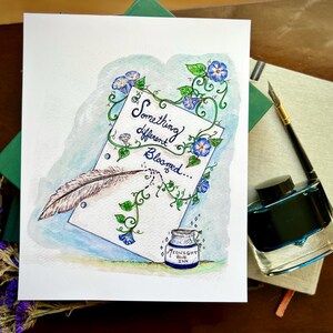 May include: Watercolor painting of a blue and green floral design with a white paper scroll that says "Something different Bloomed..." and a feather quill pen. A small bottle of ink is in the lower right corner with the label "Midnight Blue Ink".