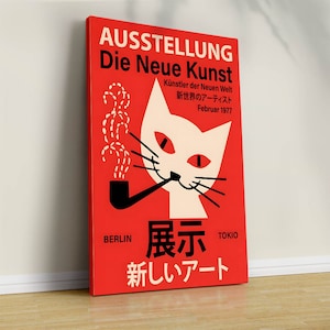 May include: A red poster with a white cat smoking a pipe. The poster is titled "AUSSTELLUNG Die Neue Kunst" and features the text "K&uuml;nstler der Neuen Welt" and "新世界のアーティスト" in Japanese. The poster also includes the text "BERLIN 展示 TOKO" and "新しいアート" in Japanese.