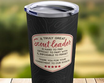 May include: A black and white tumbler with a red and white graphic that reads "A truly great Scout leader is hard to find, difficult to part with & impossible to forget. Thank you for your commitment to our scouts."