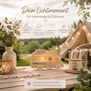 May include: A light-colored, camper-shaped decorative lamp made of PLA material, featuring a warm LED light inside. The lamp is displayed on a wooden table alongside a white mug with the text 'HOME is where you PARK IT' and a small candle holder.