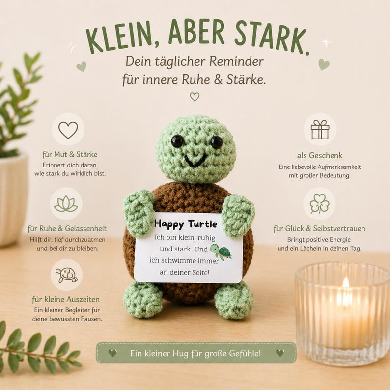 May include: A crocheted turtle with a green head and limbs, and a brown body, holding a card that says "Happy Turtle". The image includes text in German, a lit candle, and a sprig of greenery. The turtle is a reminder of inner peace and strength.