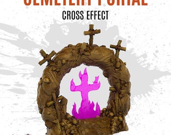 Może przedstawiać: Brązowy portal o tematyce cmentarnej z napisem "Cemetery Portal" i "Cross Effect". Portal posiada otwór w kształcie krzyża z różowym, świecącym krzyżem w środku. Portal jest ozdobiony krzyżami i czaszkami.