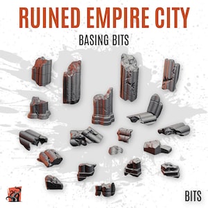 May include: A collection of 18 grey and brown miniature ruined city pieces for tabletop gaming. The pieces are made of plastic and are designed to look like broken columns, walls, and other debris. The pieces are scattered on a white background. The text "RUINED EMPIRE CITY BASING BITS" is at the top of the image. The text "BITS" is at the bottom of the image.