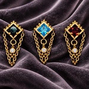 May include: Three gold-toned metal earrings featuring a diamond-shaped setting with a central gemstone in dark green, bright blue, and deep red. Each earring includes a dangling gold chain, a small circular charm, and a clear round stone.