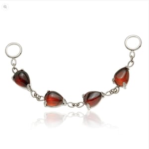 May include: A silver chain featuring five teardrop-shaped, dark red gemstones. The chain has a ring at each end. The gemstones are set in silver prongs and linked by small silver chain segments. The jewellery is displayed on a white background.