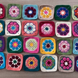 May include: Twenty-four colorful crocheted squares with a flower design in the center. Each square has a different color combination and pattern.
