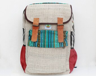 May include: A beige hemp backpack with a large front pocket featuring a colourful woven pattern. The backpack has brown leather straps and red accents.