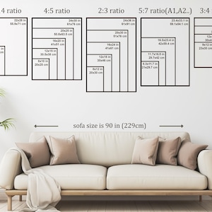 May include: Image showing various rectangular frame sizes in inches and centimeters, including 11x14, 16x20, and 24x36. A sofa, approximately 90 inches (229cm) wide, is positioned below the frames. The scene is set against a white wall.