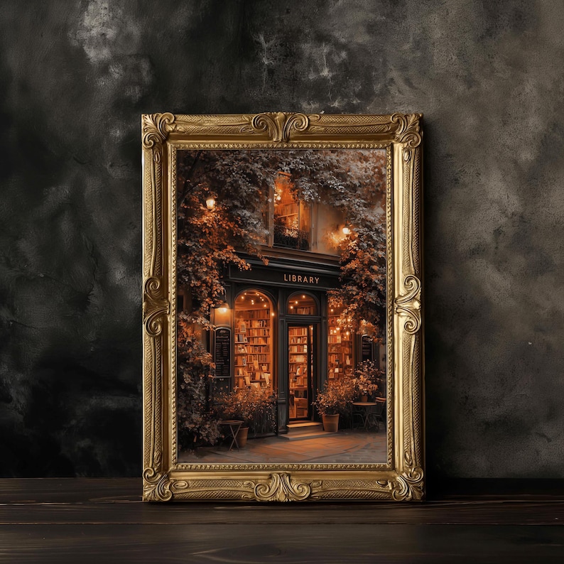 May include: A framed print of a library exterior, featuring a black awning with the word "LIBRARY" in white. The print has a gold ornate frame. The library's entrance is illuminated, showcasing bookshelves and warm lighting, surrounded by lush greenery.