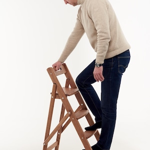 Handmade oak folding ladder for kitchen,library and home.The ladder is strong,reliable and comfortable.Book stand flowers and clothes hanger