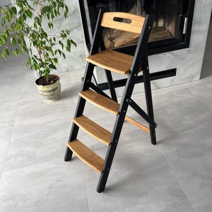 Folding ladder made of natural oak for the kitchen or library, wooden ladder, 4-step rustic ladder, high wooden plant stand, prop for photo.