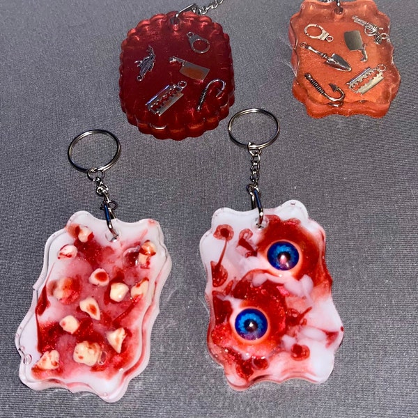 Horror Keychains – Creepy Chic Resin Charms for Spooky Accessory Lovers. 3D style Eyes and Teeth, weapons handmade from resin and fillers