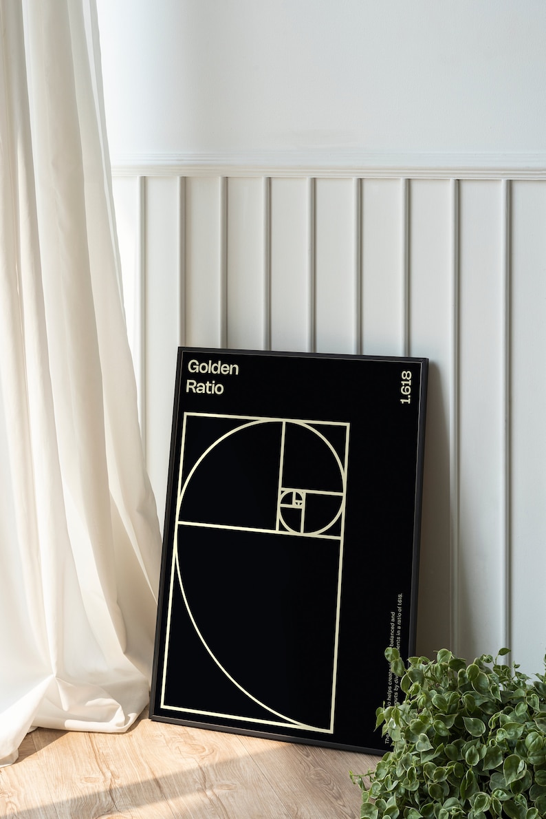 May include: A black framed poster with a gold graphic of the golden ratio, a mathematical concept that appears in nature. The poster has the text "Golden Ratio" and "1.618" in gold lettering.