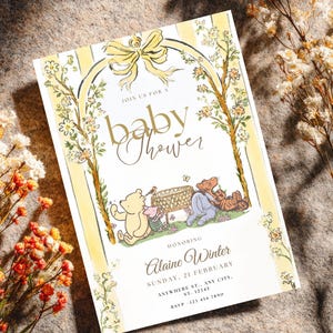 May include: Baby shower invitation with a watercolor design. The invitation features Winnie the Pooh characters, floral accents, and the text "baby shower". The invitation is in a vertical format with a yellow and white color scheme.