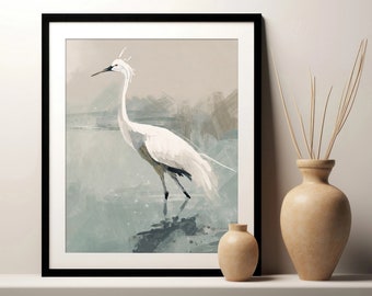 May include: A framed watercolour painting of a white egret standing in a blue and green water setting. The egret has a long neck and long legs. The background is a soft, abstract design.