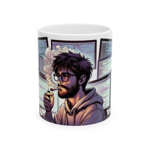 May include: A white ceramic mug featuring a graphic illustration of a bearded person with glasses wearing a hoodie, smoking a cigarette while surrounded by multiple computer monitors displaying lines of code and emitting a plume of smoke.