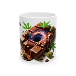 May include: White ceramic mug featuring a chocolate bar design with a galaxy-like center and cannabis leaves. The chocolate appears to be melting, with green buds and small chocolate drops. The mug has the word "chocolate" on it.