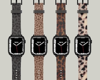 Puede incluir: Cuatro smartwatches con cajas negras y correas con estampados de animales. Las correas presentan estampados de leopardo, jirafa y otros patrones manchados en tonos marrones, negros y beige. Los relojes muestran la fecha como martes 14.