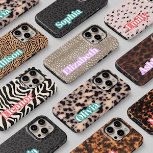 May include: A collection of phone cases with various animal print designs, including zebra, leopard, and cheetah patterns. Each case features a name in a colorful font, such as "Sophia" and "Elizabeth". The cases are designed for a smartphone.