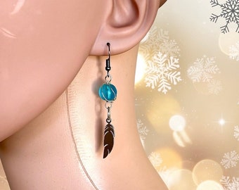 blue dangling earring with feather