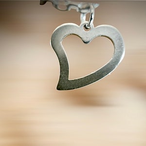 Women's silver chain decorated with a heart image 2