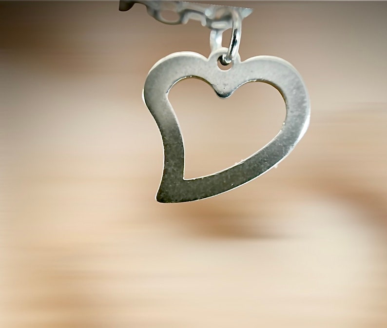 Women's silver chain decorated with a heart image 2