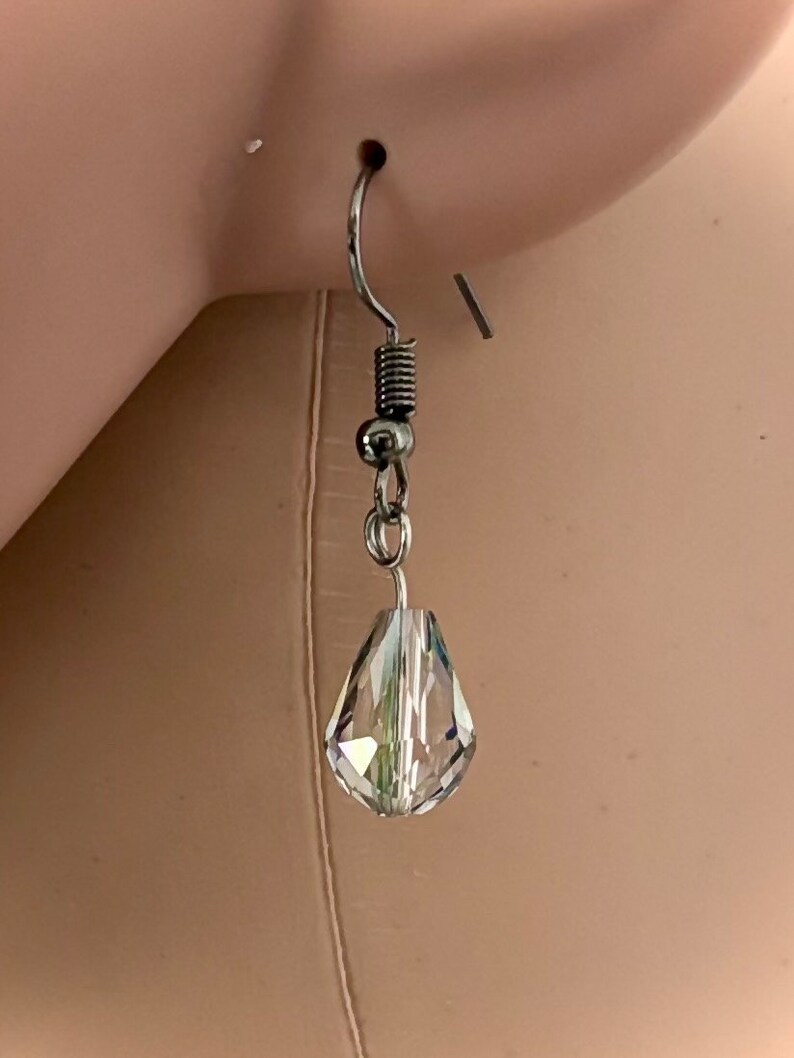 hypoallergenic earrings with transparent drop-shaped crystal image 1